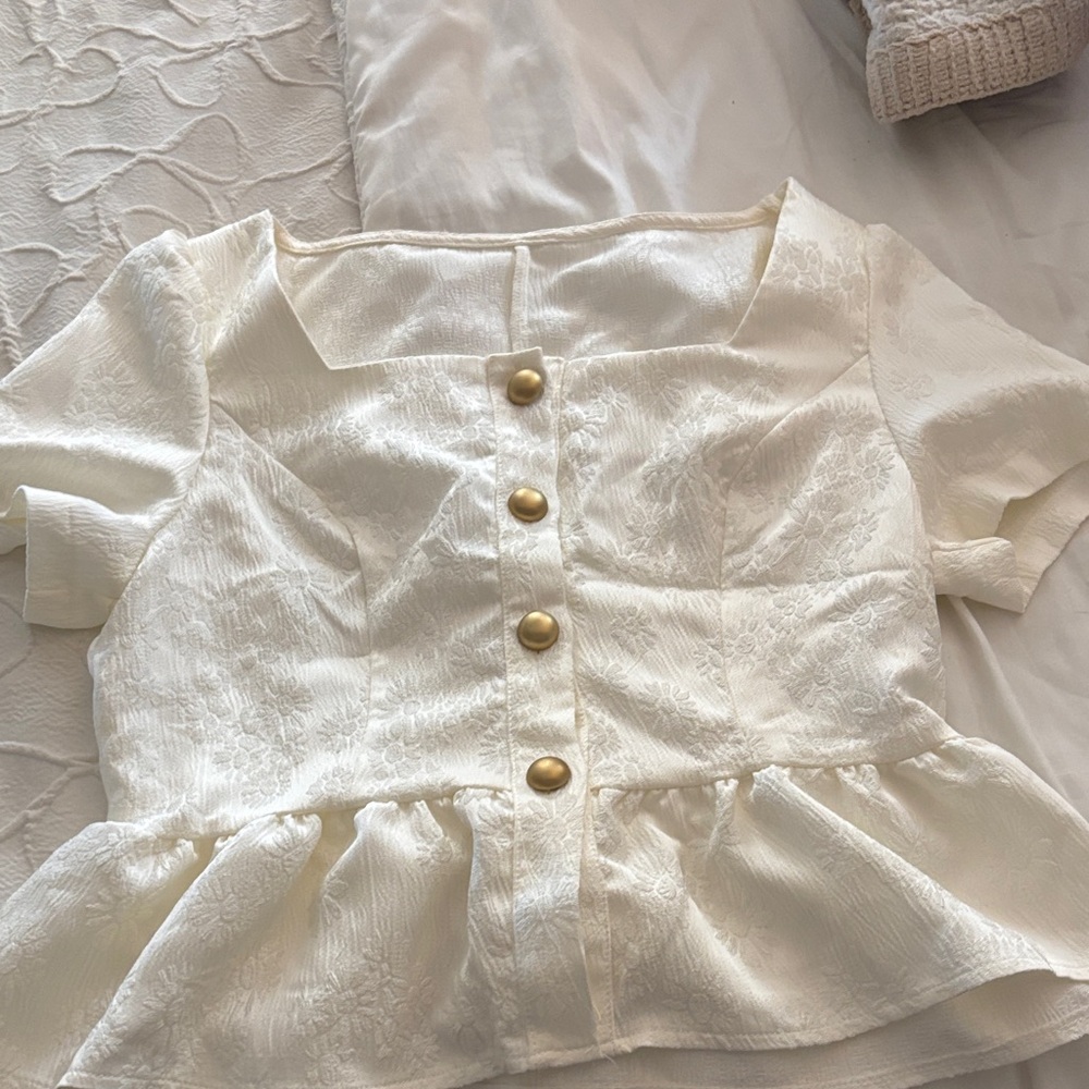 Elegant Cream Top with Gold Accents